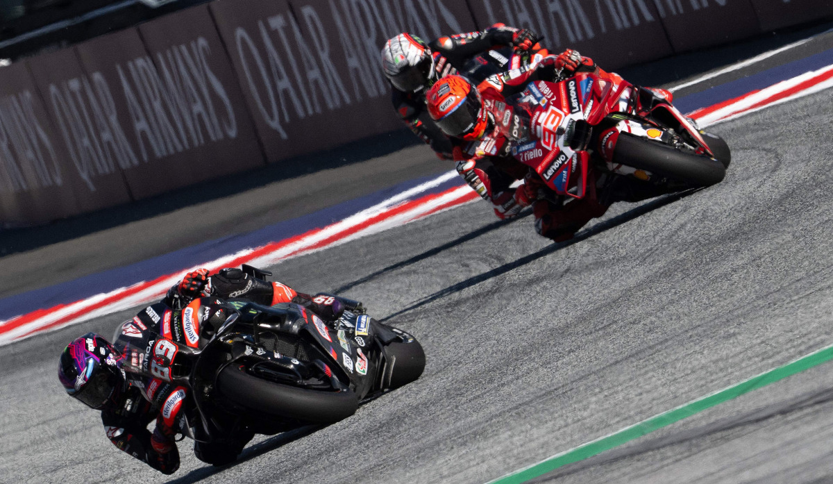 Aprilia Racing's Spanish driver Jorge Martin (L) and Ducati Lenovo Team's Spanish driver Marc Marquez compete during the Sprint event of the Grand Prix of Austria MotoGP in Spielberg bei Knittelfeld, Austria, on September 19, 2026. (Photo by Joe Klamar / AFP)
