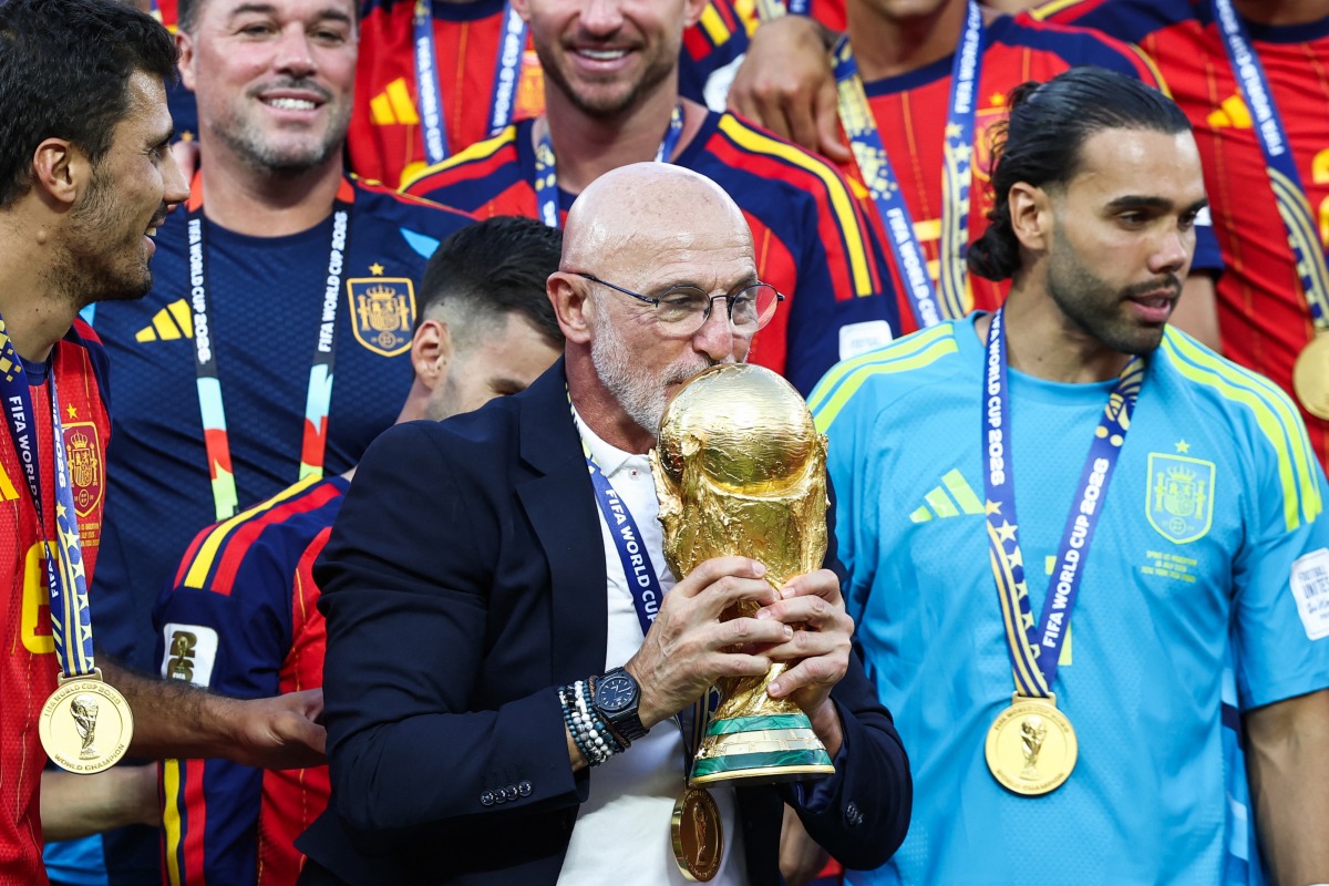 Spain's head coach Luis de la Fuente kisses the trophy after winning the 2026 World Cup football tournament final match between Spain and Argentina at the New York/New Jersey Stadium in East Rutherford on July 19, 2026. (Photo by Franck Fife / AFP)

