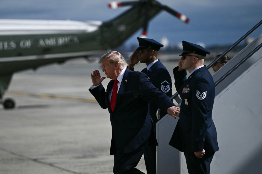 US President Donald Trump steps off Air Force One upon arrival to John F. Kennedy International Airport in New York on September 21, 2026. (Photo by Brendan Smialowski / AFP)