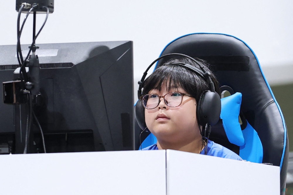 Japan's Yuki Kurihara competes in the Puyo Puyo Champions final of the eSports event during the 2026 Asian Games at the Aichi Sky Expo in Tokoname on September 26, 2026. (Photo by JIJI PRESS / AFP) 