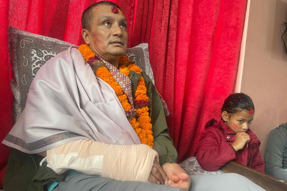Nepali flood survivor Kabir Maharjan in an AFP interview at his home in Kirtipur on September 25, 2026. (Photo by Anup Ojha / AFP)