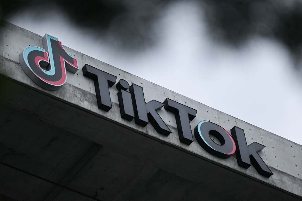 (Files) The TikTok logo is displayed outside TikTok social media app company offices in Culver City, California, on March 16, 2023. (Photo by Patrick T. Fallon / AFP)