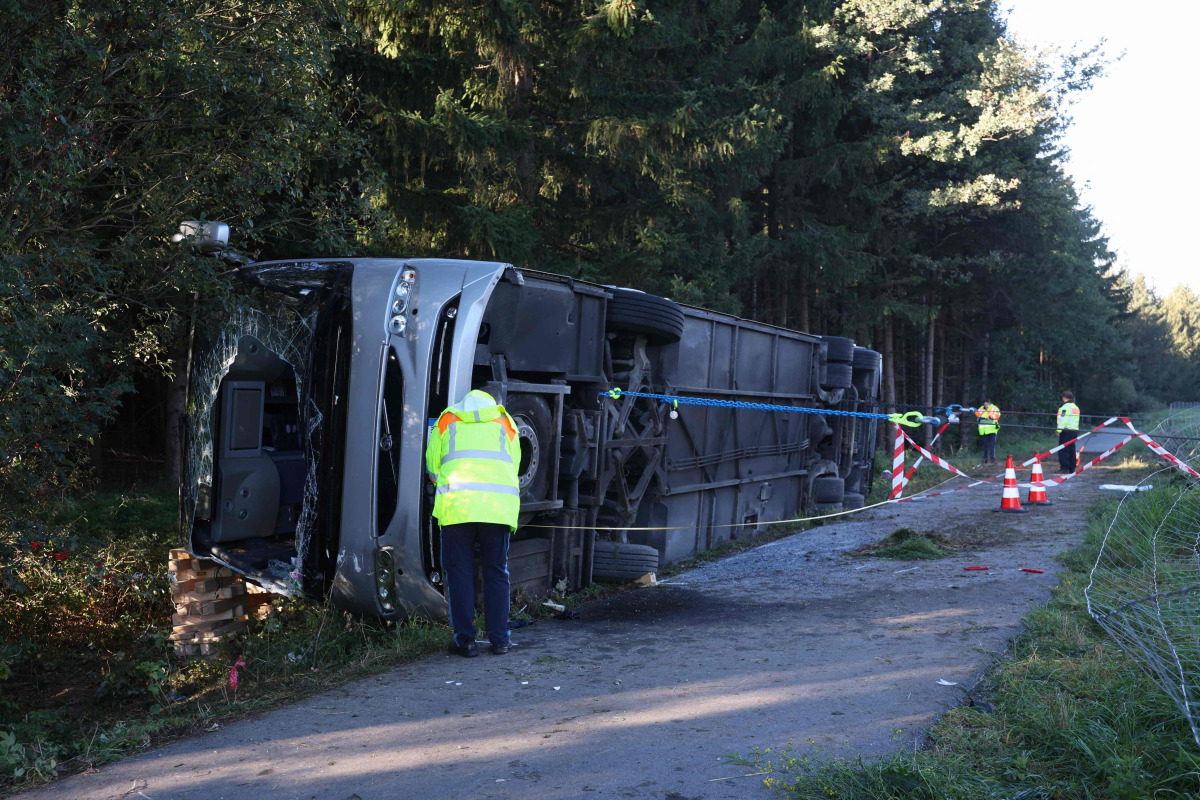 Emergency services and firefighters work at the site of a bus accident near Buchloe-Ost, southern Germany, early on September 27, 2026, where the coach had overturned on the A96 motorway. Photo by Karl-Josef Hildenbrand / dpa / AFP
