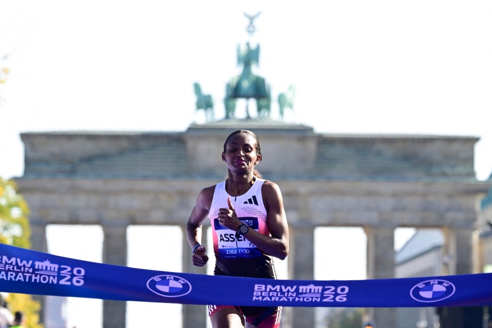 Ethiopia's Tigst Assefa crosses the finish line to win the women's race of 52nd Berlin Marathon in Berlin, Germany on September 27, 2026. (Photo by John MacDougall / AFP)
 