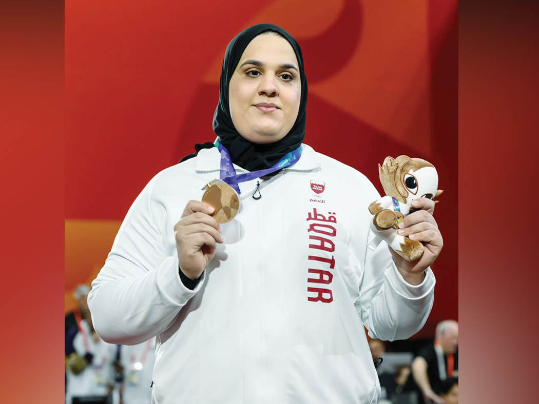 Ouisal Ikhlef celebrates with her bronze medal.