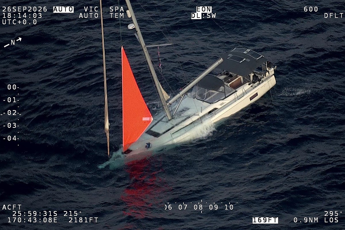 This handout image taken on September 26, 2026 and released by the New Zealand Defence Force on October 1, 2026 shows a yacht sinking after a sperm whale struck and cracked the hull in the remote South Pacific. Photo by HANDOUT / NEW ZEALAND DEFENCE FORCE / AFP