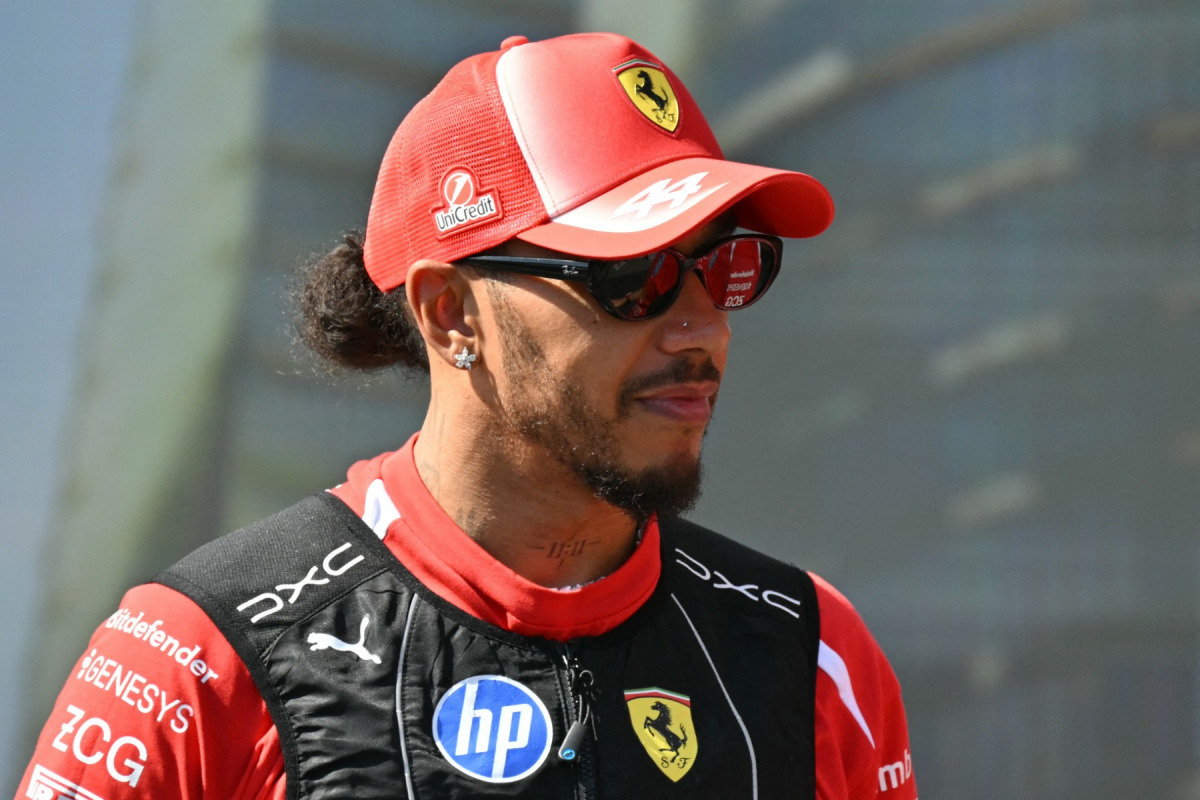 Ferrari's British driver Lewis Hamilton attends the drivers' presentation prior to the Formula One Azerbaijan Grand Prix at the Baku City Circuit in Baku on September 26, 2026. (Photo by Andrej ISAKOVIC / AFP)
