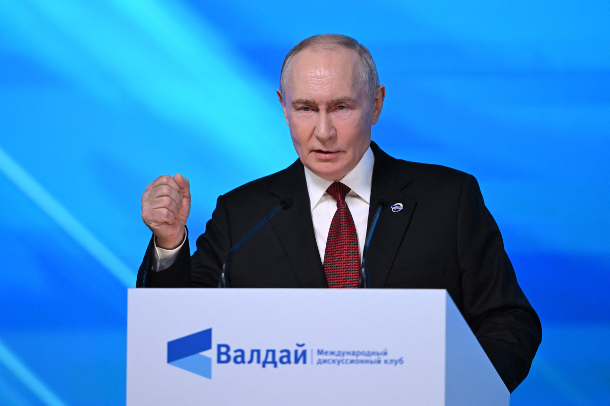 Russia's President Vladimir Putin gestures as he addresses the audience during the Valdai Discussion Club meeting in Moscow on October 1, 2026. (Photo by Igor IVANKO / AFP)
