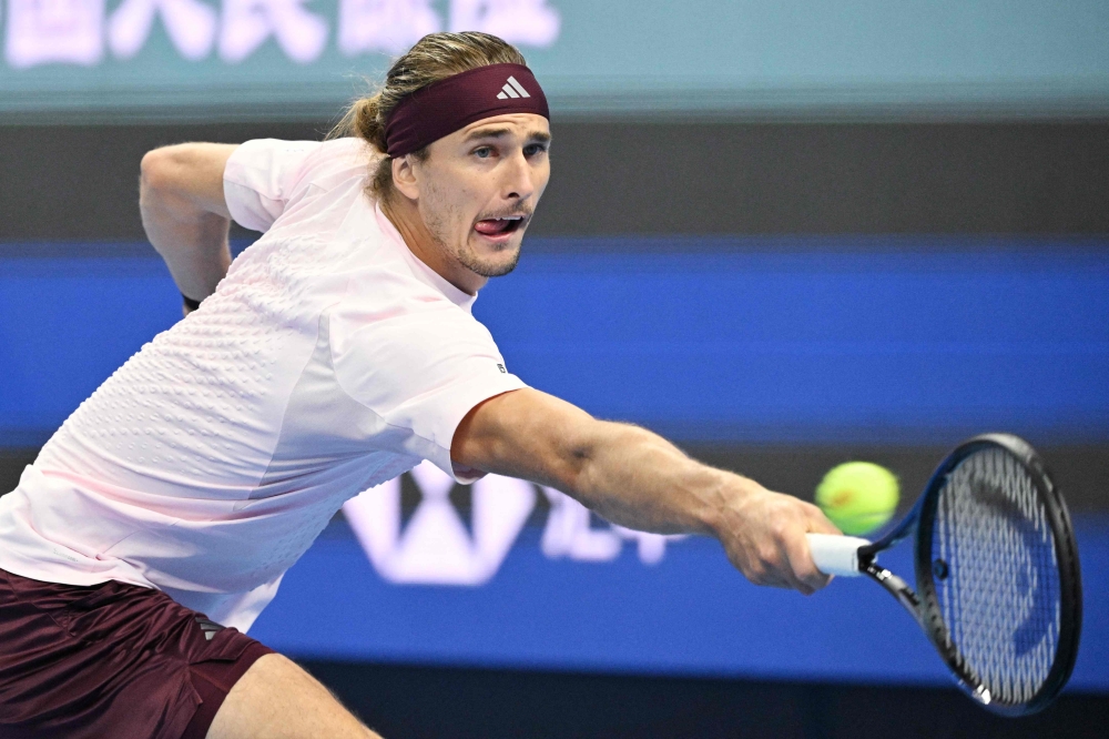 Germany Alexander Zverev hits a return to China Shang Juncheng during their men singles match at the China Open tennis tournament in Beijing on October 3, 2026. (Photo by GREG BAKER / AFP)
