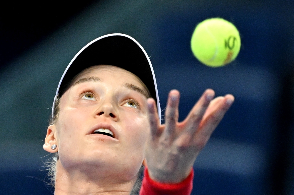 :Kazakhstan Elena Rybakina serves to Armenia Alina Charaeva during their women singles match at the China Open tennis tournament in Beijing on October 3, 2026. (Photo by GREG BAKER / AFP)