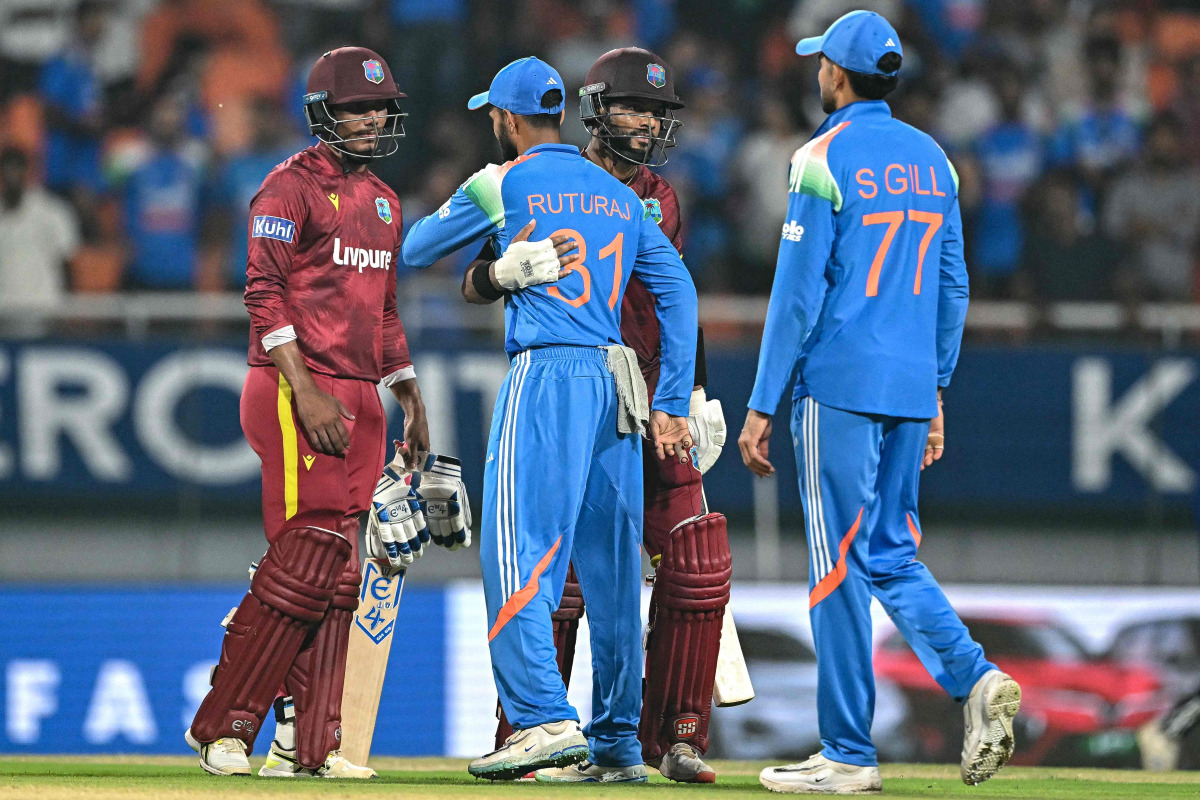 West Indies' captain Shai Hope (2R) and Gudakesh Motie (L) greet India's Ruturaj Gaikwad (2L) and captain Shubman Gill at the end of the third one-day international (ODI) cricket match between India and West Indies at the Maharaja Yadavindra Singh International Cricket Stadium on the outskirts of Chandigarh on October 3, 2026. (Photo by Sajjad HUSSAIN / AFP)