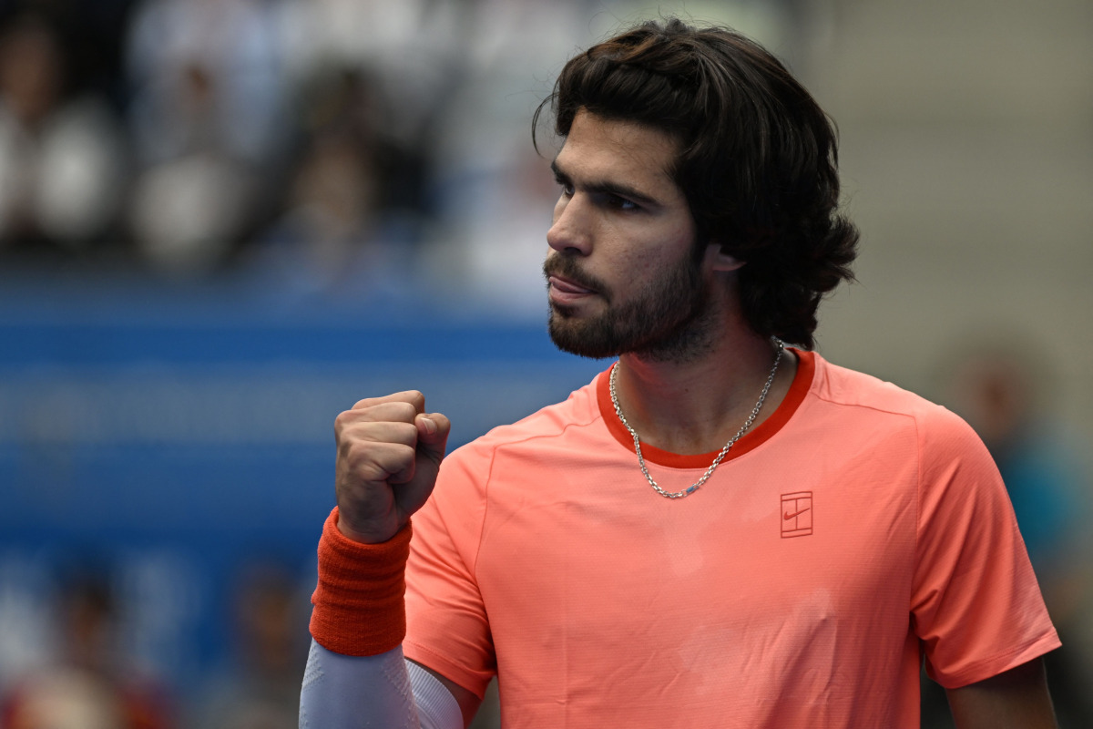 Spain's Carlos Alcaraz reacts as he plays against Canada's Denis Shapovalov during their men's singles quarter-final tennis match at the ATP Tour Japan Open Tennis Championships at the Ariake Tennis Forest Park in Tokyo on October 4, 2026. (Photo by Rie KIKUCHI / AFP)