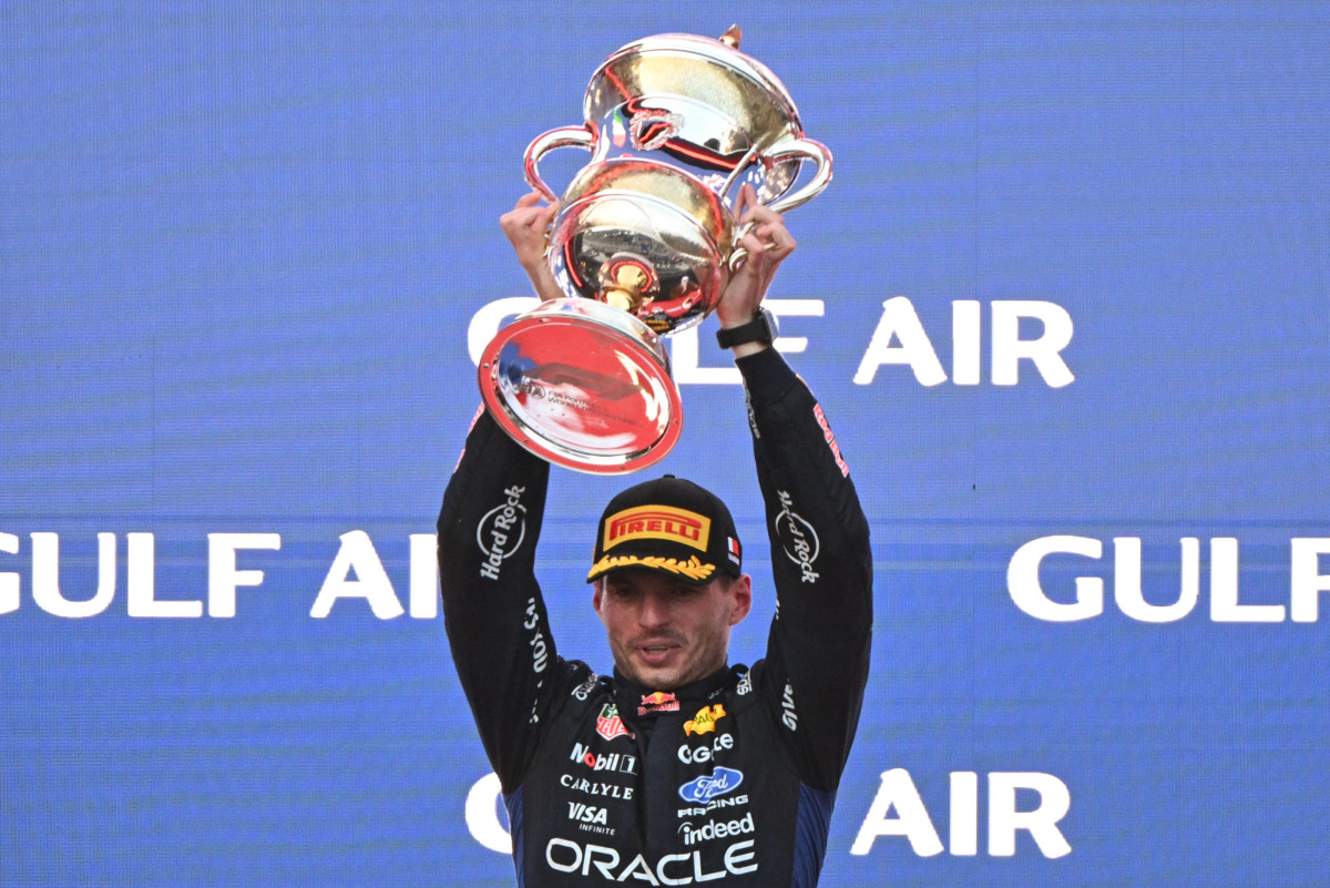 Race winner Red Bull Racing's Dutch driver Max Verstappen lifts his trophy during podium ceremony of the Formula One Bahrain Grand Prix in Sepang on October 4, 2026. (Photo by Jade Gao / AFP)