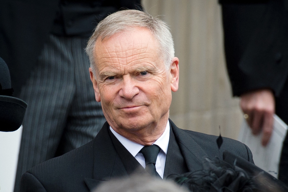 (Files) British author and former MP Jeffrey Archer leaves St Paul's Cathedral at the end of British former prime minister Margaret Thatchers ceremonial funeral in central London on April 17, 2013. (Photo by Leon Neal / AFP)