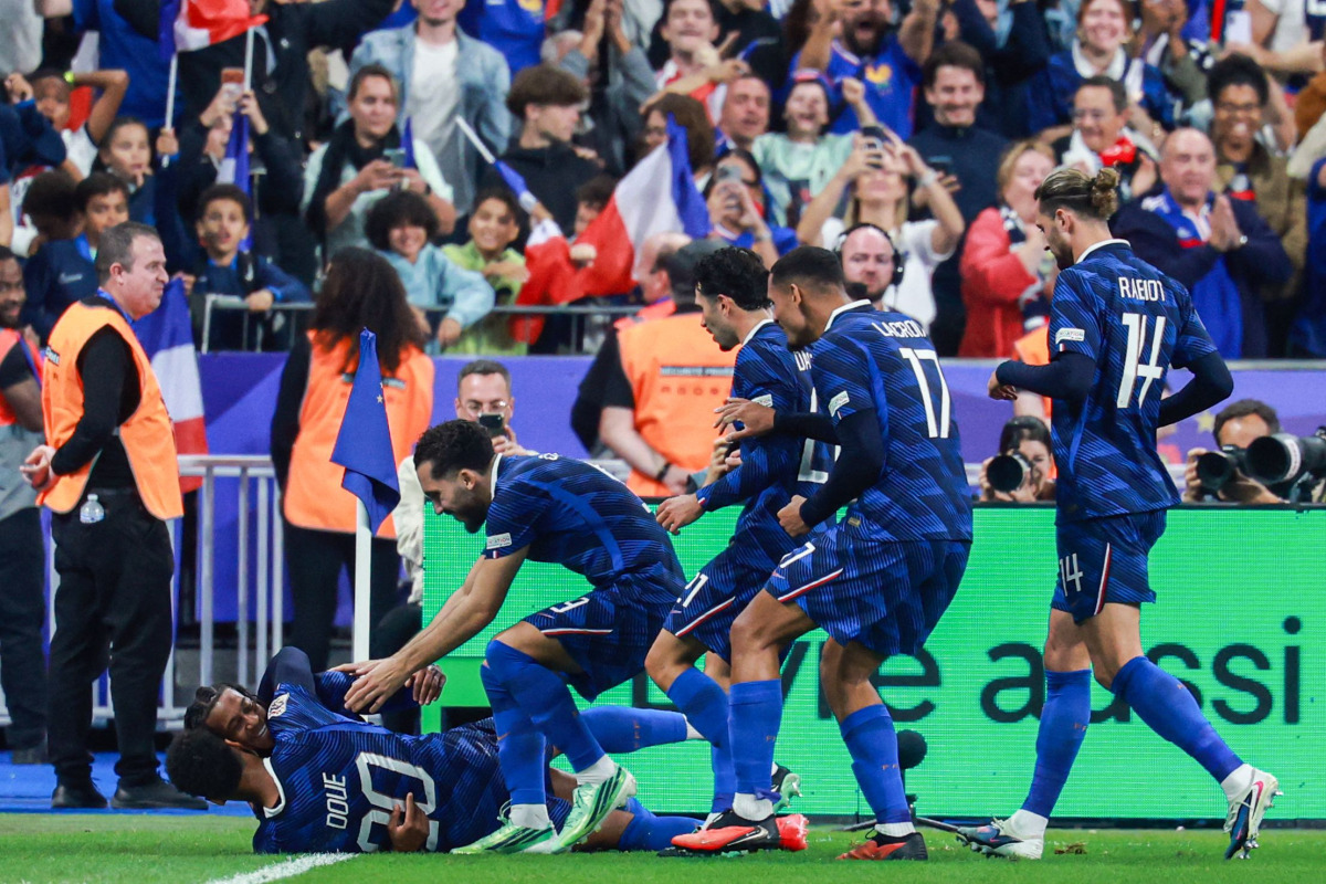 France’s Michael Olise (left) celebrates scoring his team’s fourth goal with teammates. 