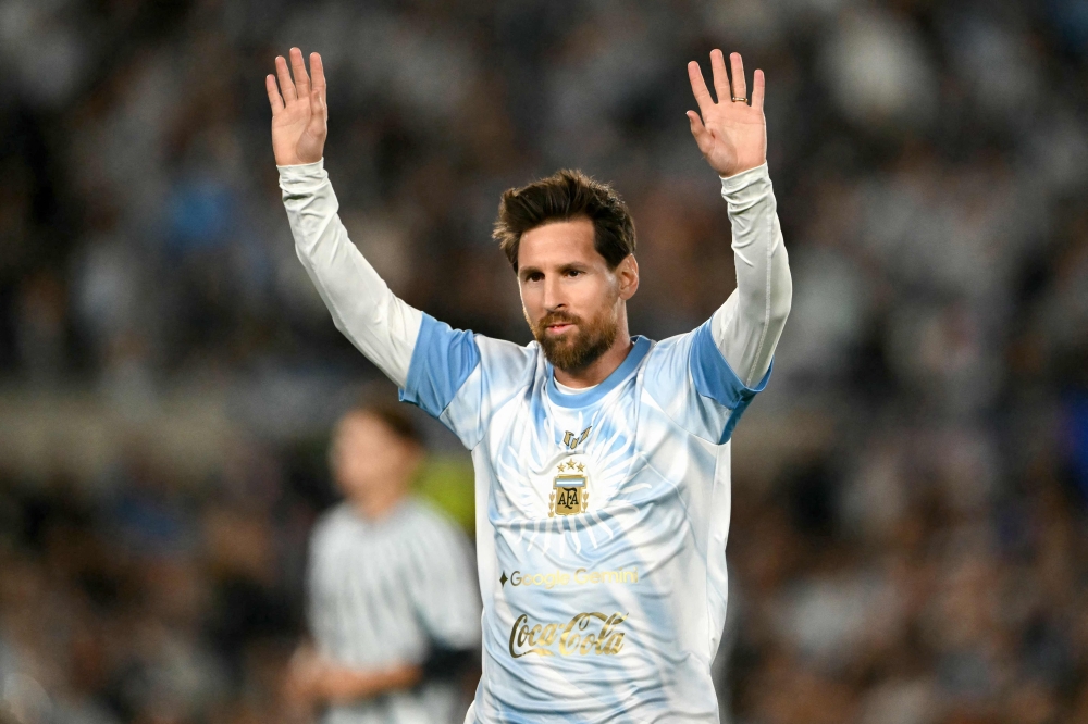 Argentina's forward #10 Lionel Messi waves to fans in Buenos Aires on October 6, 2026. (Photo by Luis Robayo / AFP)