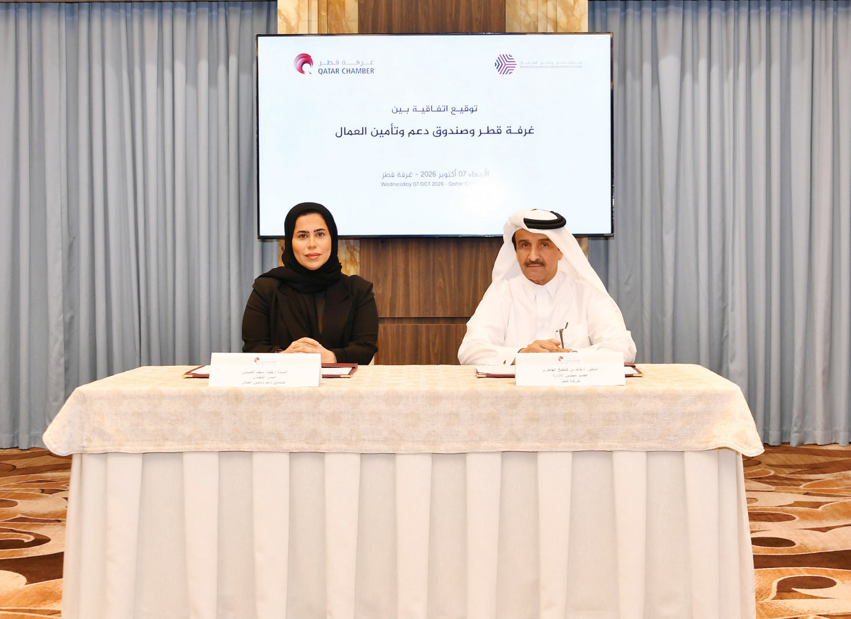 QC Board Member Dr. Khalid bin Klefeekh Al Hajri, and on behalf of the Workers’ Support and Insurance Fund Executive Director Kholoud Saif Al Kubaisi during the signing of the agreement. 
