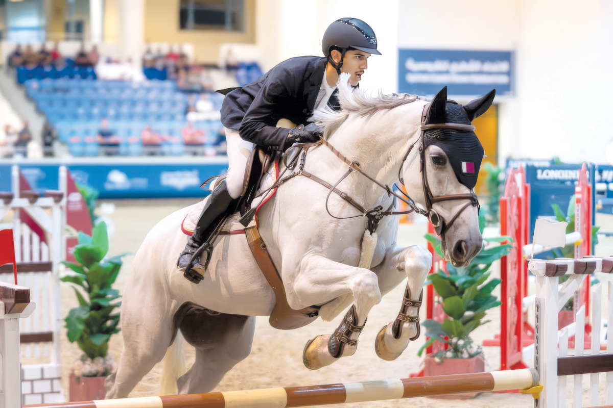 Mohammed Yousef Al Jaber guides Shotgun 7 over a fence.