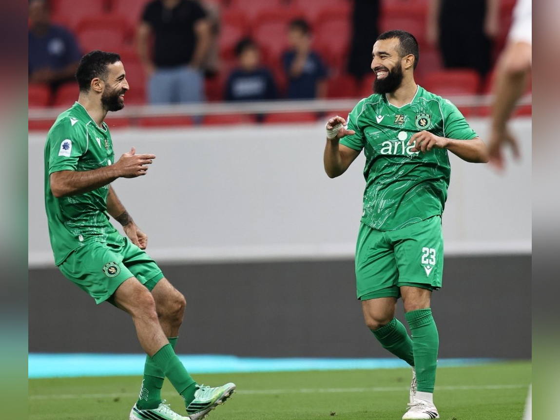 Al Ahli’s Naim Sliti (right) celebrates after scoring a goal. 