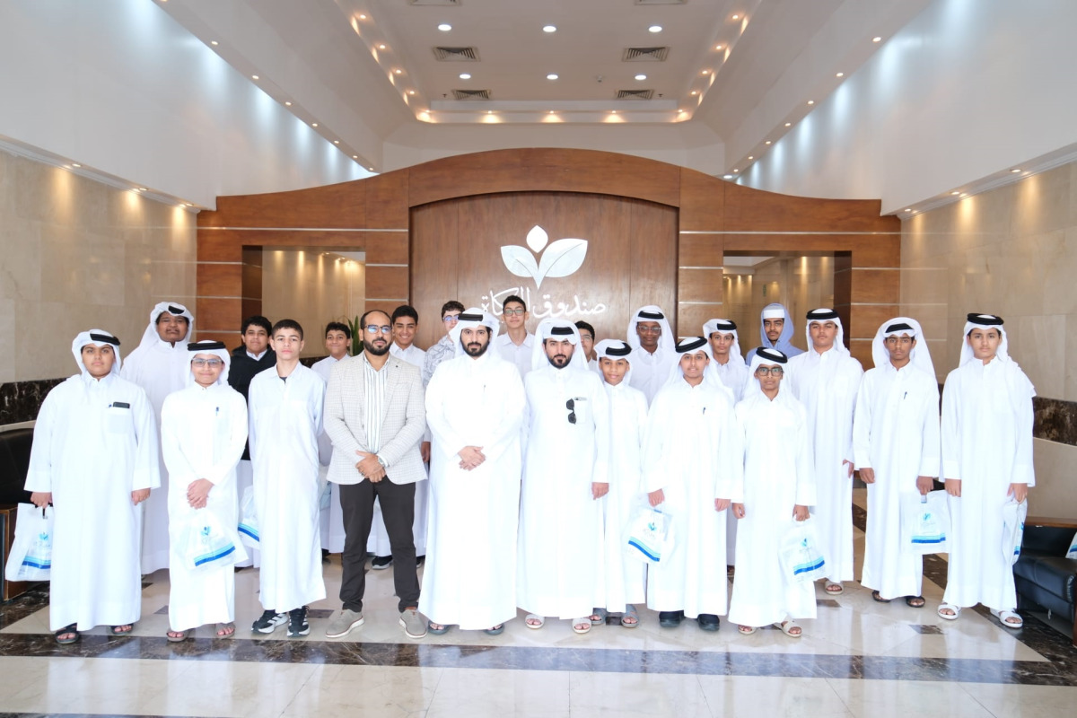 Officials from Zakat Affairs Department with the school students during the awareness visit.