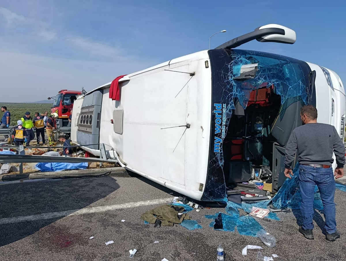 This handout photograph taken and released on October 11, 2026 by Turkish news agency DHA (Demiroren News Agency) shows fire department and first aid officials operating at the site of a crashed bus following the collision of a tour bus and a lorry in Manisa, west of Turkiye.  Photo by Handout / DHA (Demiroren News Agency) / AFP