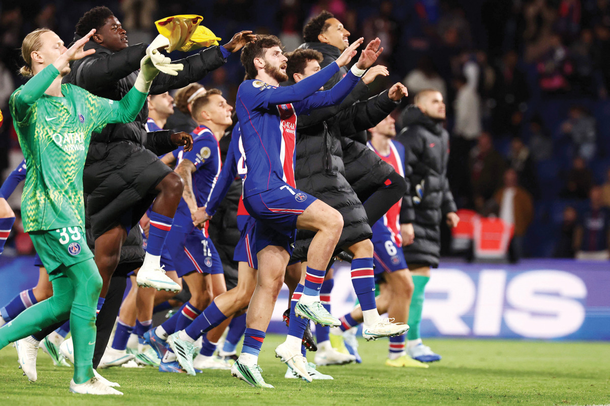PSG’s Khvicha Kvaratskhelia (centre) celebrates team’s victory over Le Mans FC with teammates on Saturday. (AFP)