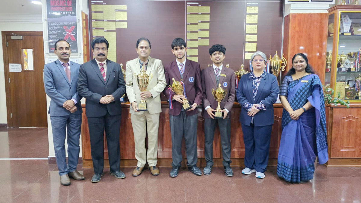 Principal of BPS, Dr. Anand R Nair, with teachers and the students who won the competition.