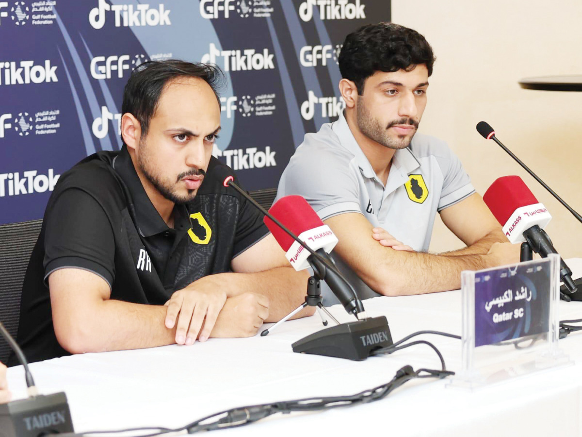 Qatar SC's new coach Rashid Al Kubaisi (left) speaks during a press conference.