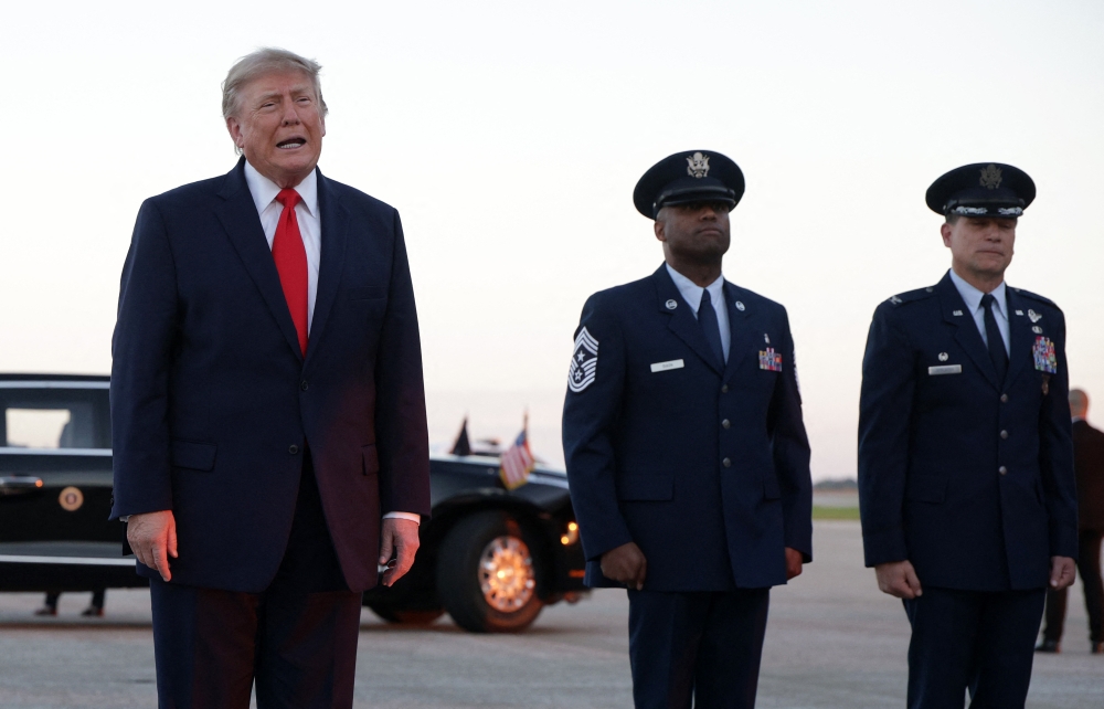 US President Donald Trump talks with members of the media after landing at Youngstown Air Reserve Station on October 12, 2026 in Vienna, Ohio. Alex Wong/Getty Images/AFP