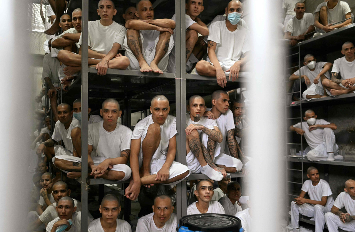 Inmates are pictured during a visit of Costa Rica's President Laura Fernandez at the CECOT prison in Tecoluca, El Salvador on October 16, 2026. (Photo by Marvin RECINOS / AFP)