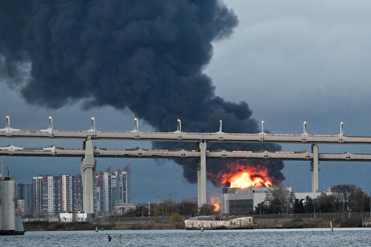 Smoke rises above the city following an air attack on the oil terminal in Saint Petersburg on October 18, 2026, amid the ongoing Russian-Ukrainian conflict. (Photo by AFP)