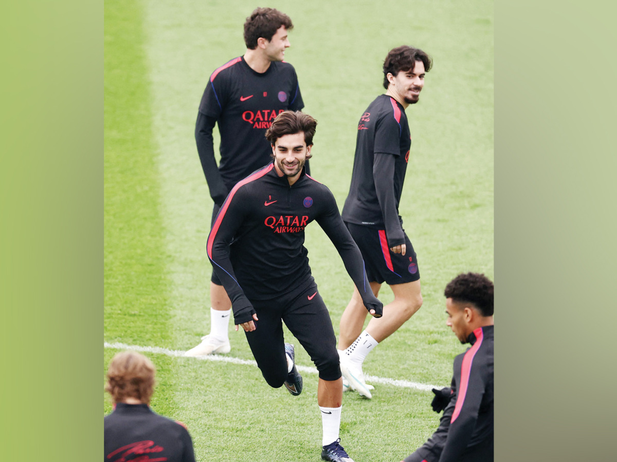 PSG’s Ferran Torres (centre) attends a training session with teammates.