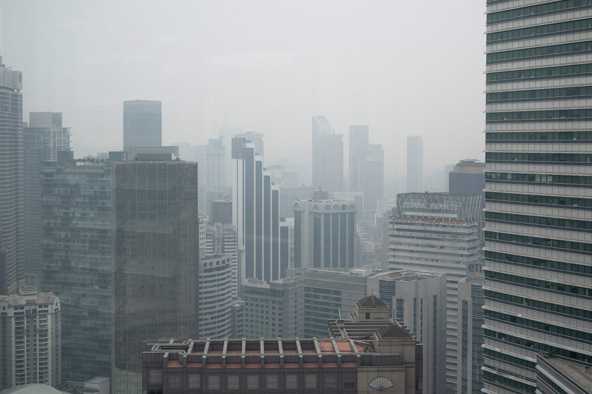 High-rise buildings are seen in Kuala Lumpur on October 20, 2026, as Malaysia continues to be shrouded in haze caused by fires in Indonesia. (Photo by Mohd Rasfan / AFP)