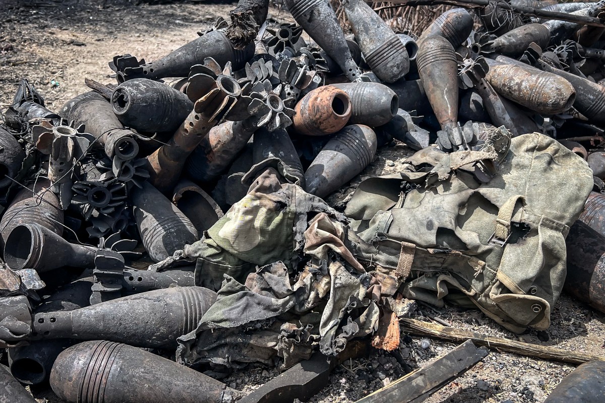 Mortar shells and other ammunition remnants lie scattered along a road following clashes between Ethiopian federal forces and armed groups opposed to the government in Adigrat on October 17, 2026. AFP.