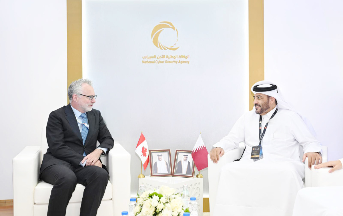 NCSA President H E Eng. Abdulrahman bin Ali Al Farahid Al Malki meeting an official on the sidelines of Milipol Qatar 2026. 
