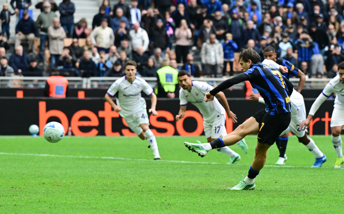 Inter Milan’s Piotr Zielinski shoots from the penalty spot to score a goal.