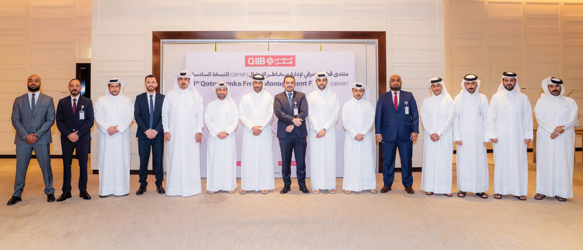 Chief of Compliance and Anti Financial Crimes at QIIB Mohammad Rifaie with other officials during the event.
