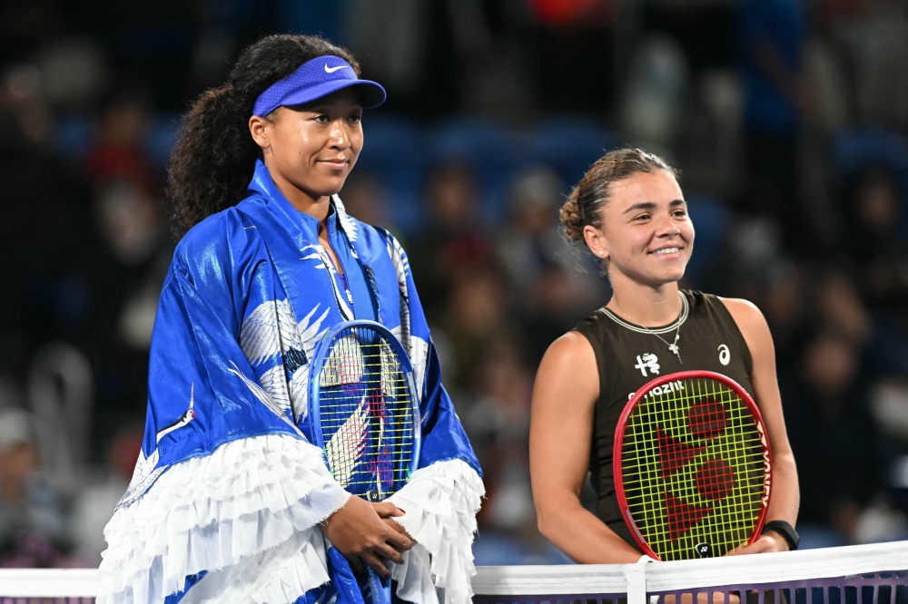Japan's Naomi Osaka (L) and Italy's Jasmine Paolini pose for photos ahead of match on October 27, 2026. (Photo by Andrew Caballero-Reynolds / AFP)