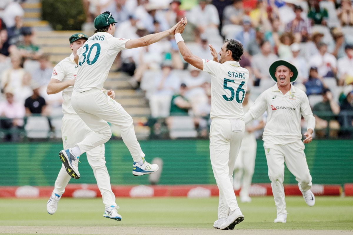 Australia’s Mitchell Starc (second right) celebrates the dismissal of South Africa’s Wiaan Mulder with teammates.