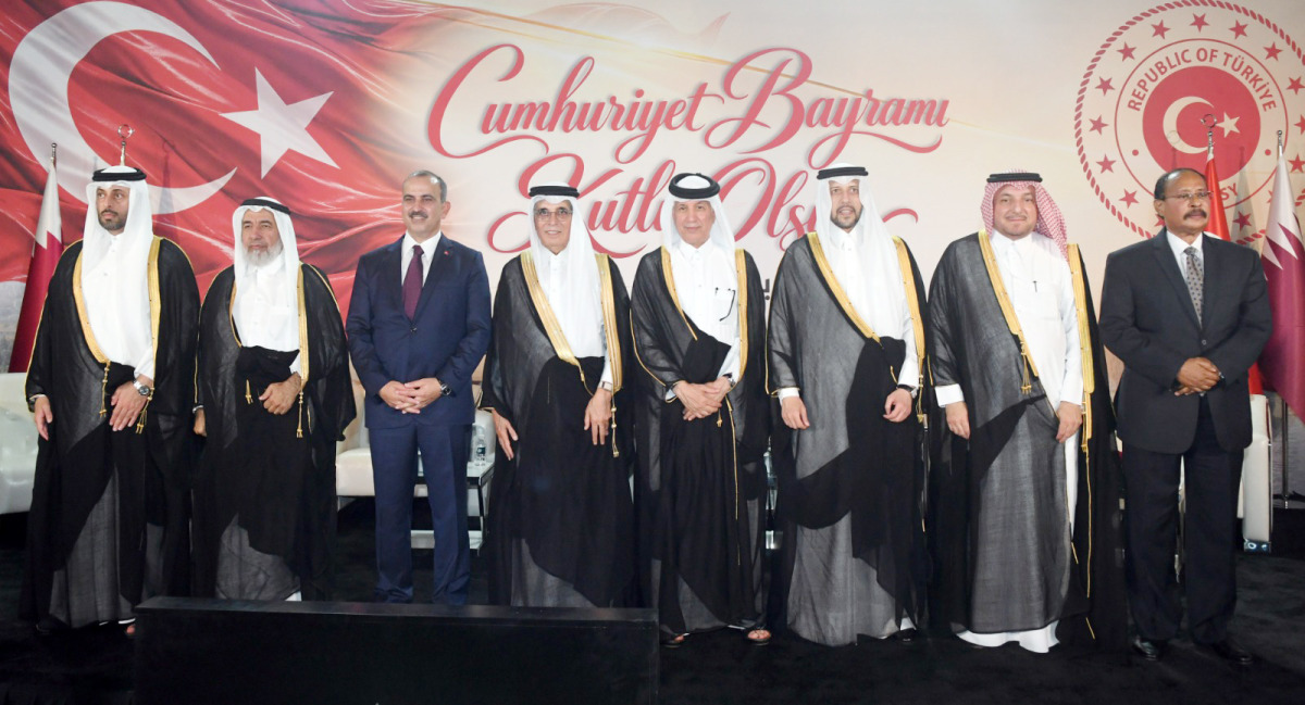 Minister of Awqaf and Islamic Affairs H E Ghanem bin Shaheen bin Ghanem Al Ghanim (second left), Minister of Municipality H E Abdullah bin Hamad bin Abdullah Al Attiyah (first left) Ambassador of Türkiye to Qatar H E Yakup Caymazoğlu (third left) and Their Excellencies the Ministers and officials at the Turkish National Day reception in Doha yesterday.