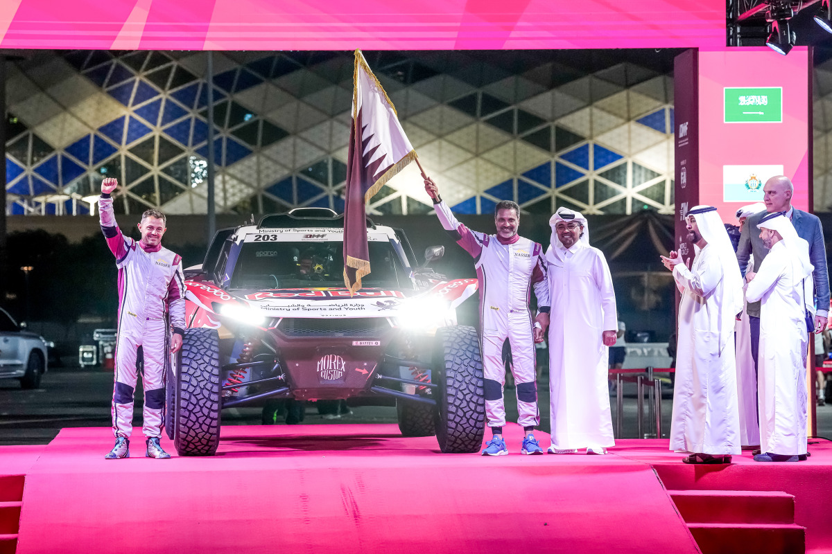 Ambassador of the Kingdom of the Netherlands to the State of Qatar H E Ferdinand Lahnstein, QMMF President Abdulrahman Al-Mannai, QMMF Executive Director Amro Al-Hamad and QMMF Board Member Abdulrazaq Al-Kuwari with Qatari driver Nasser Saleh Al-Attiyah and French navigator Max Delfino during the ceremonial start yesterday